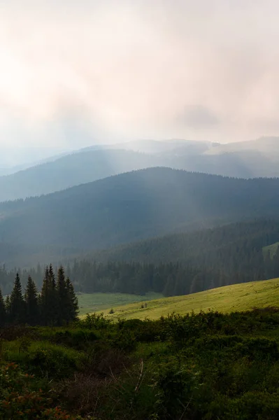 Rain clouds in the Carpathians, overcast Mount Petros, rain clouds and sun rays.
