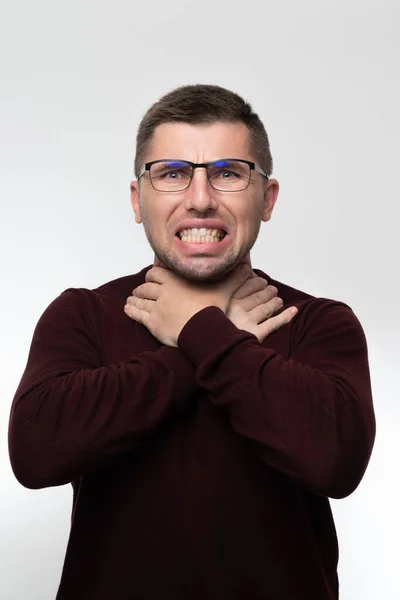 Handsome Man Glasses Isolated Background Touching Painful Neck Sore Throat — Stok fotoğraf
