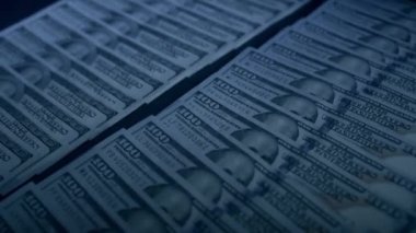 A lot of money, dollars in denominations of 100 banknotes. Millions lie on the table, rich.