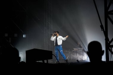 Hungary, Budapest, 12.08.2022 sziget festival  Woodkid with the team on stage in the rays of light