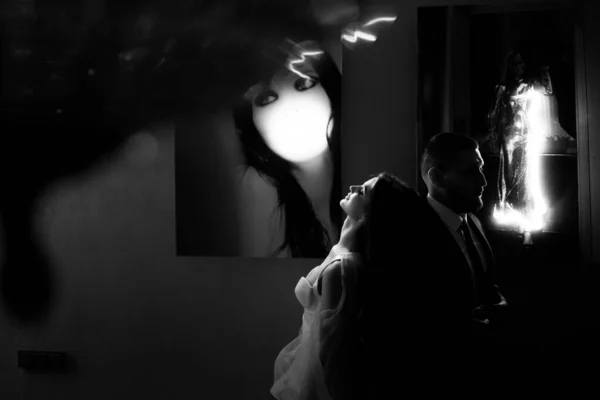 black and white portrait of bride and groom at the luxury interior background