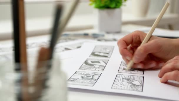 Artist Draws Cartoon Characters Storyboard Frames Sketches Comics Sheets Paper — Video Stock