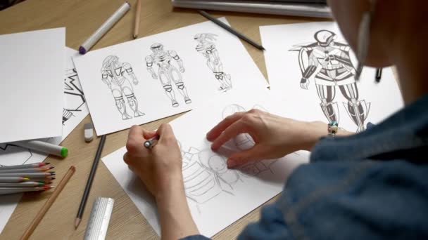 Woman Artist Draws Paper Sketches Storyboard Robots Cyborgs — Stock Video