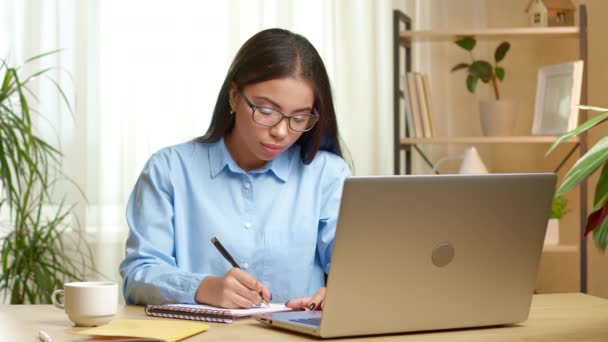 Black Female Student Writes Notebook While Watching Online Lesson Laptop — Wideo stockowe
