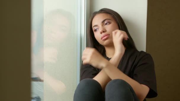 Sad Black Girl Sitting Windowsill Lonely Young Woman Looks Thoughtfully — Stock Video
