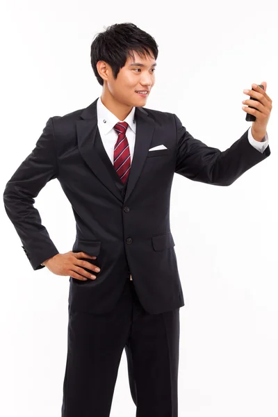 Asijské obchodní muž s mobil — Stock fotografie