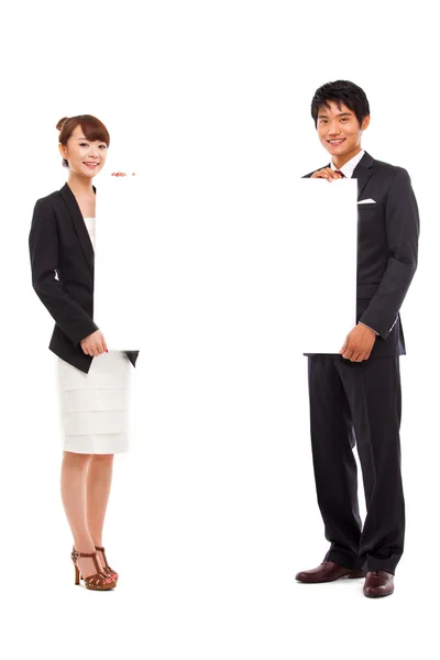 Business couple holding a add banner. — Stock Photo, Image