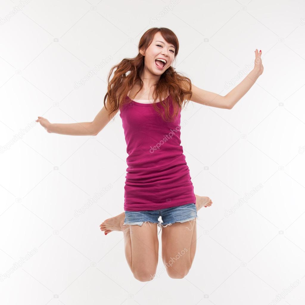 Jumping happy asian woman