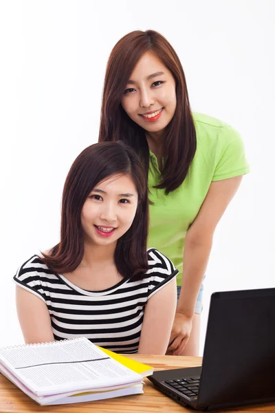 Two young Asian woman studying on the desk — Stock Photo, Image