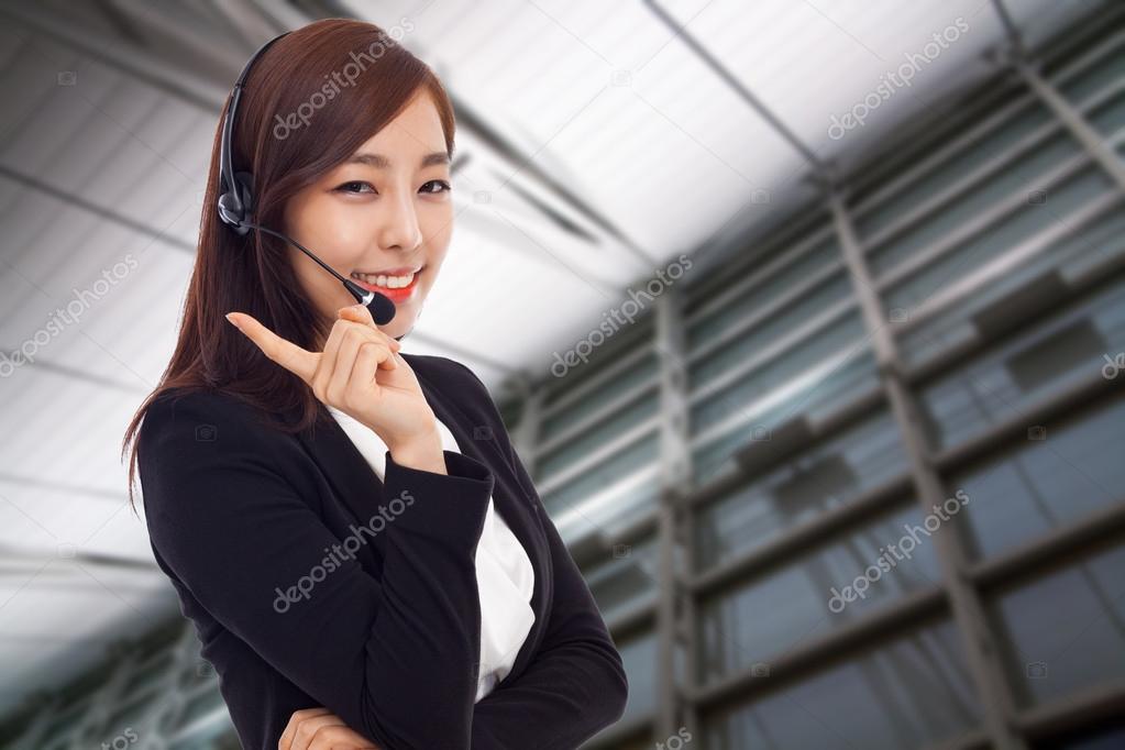 Smiling call center operator business woman