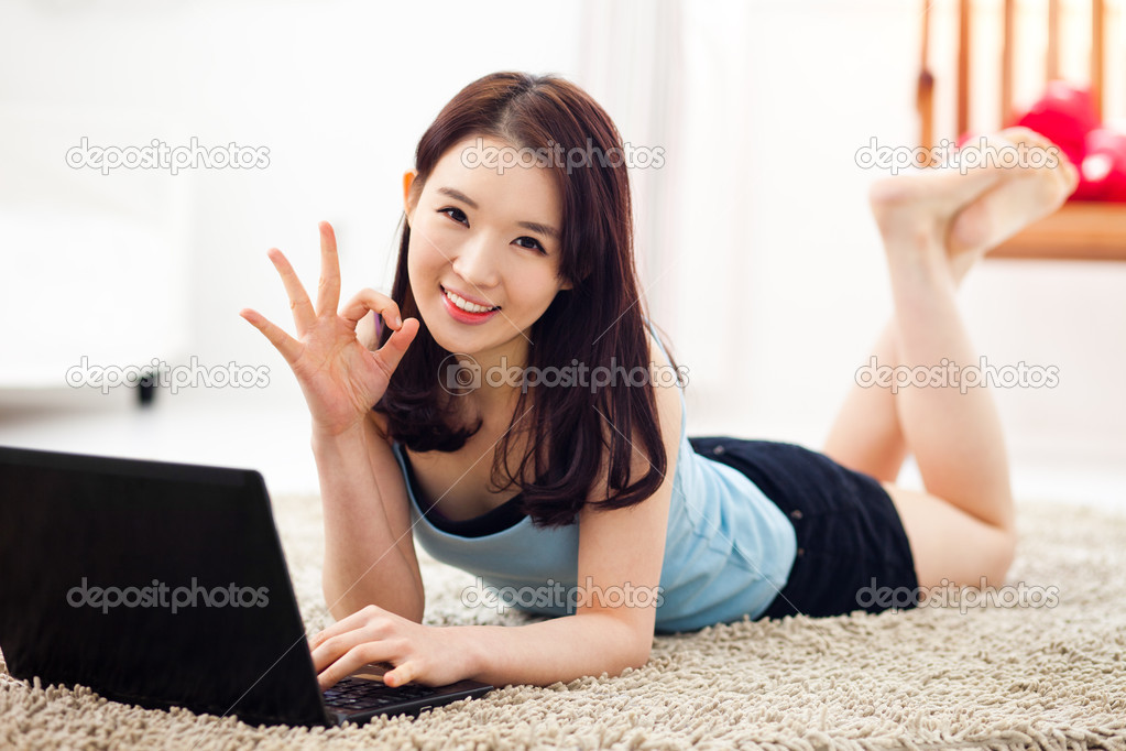 Young Asian woman using laptop