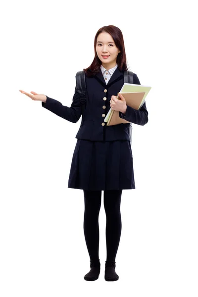 Young pretty Asian student indicate side space — Stock Photo, Image