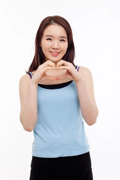 Beautiful Asian casual woman show heart shape. — Stock Photo, Image