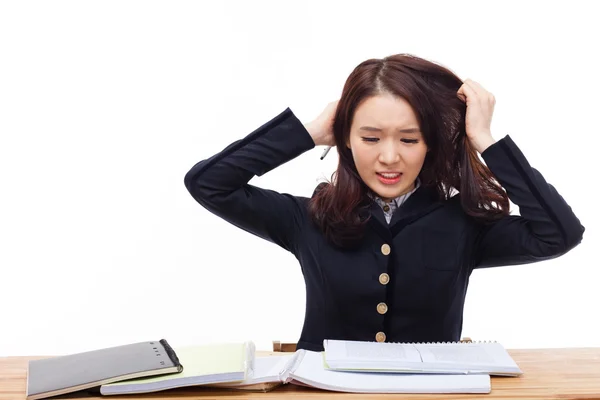 Young Asian student having trouble on desk. — Stock Photo, Image
