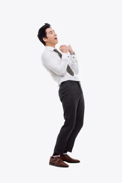 Mostrando puño joven asiático hombre de negocios . — Foto de Stock