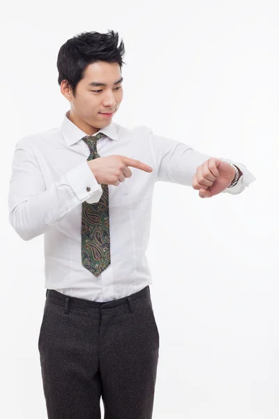 Mladý obchodník poradenství hodinky — Stock fotografie