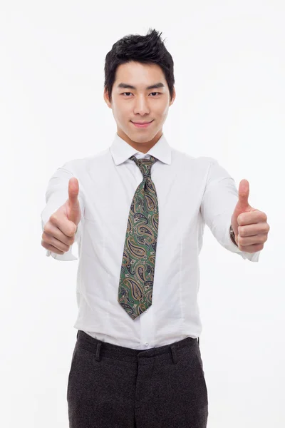 Showing thumb young Asian business man. — Stock Photo, Image