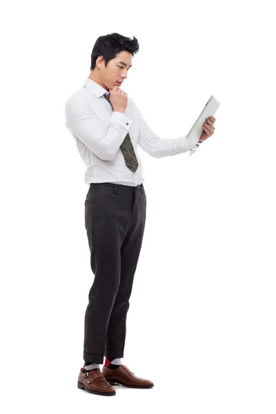 Young Asian business man using a pad PC — Stock Photo, Image