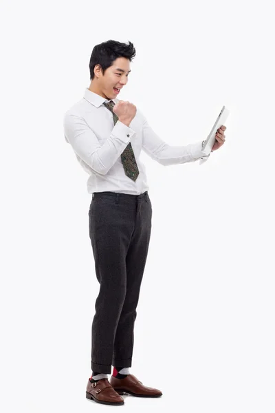 Young Asian business man using a pad PC — Stock Photo, Image