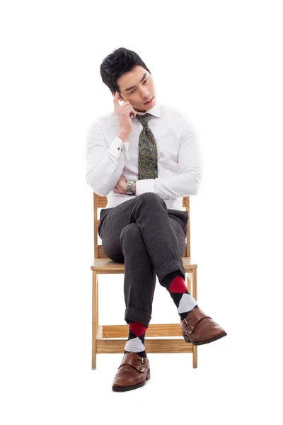 Thinking businessman sitting on the chair. — Stock Photo, Image