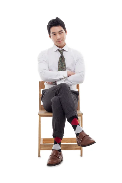 Young Asian business man sitting on the chair. — Stock Photo, Image