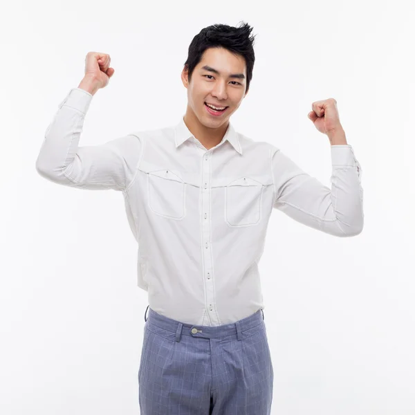 Young Asian man showing fist and happy sign. — Stock Photo, Image