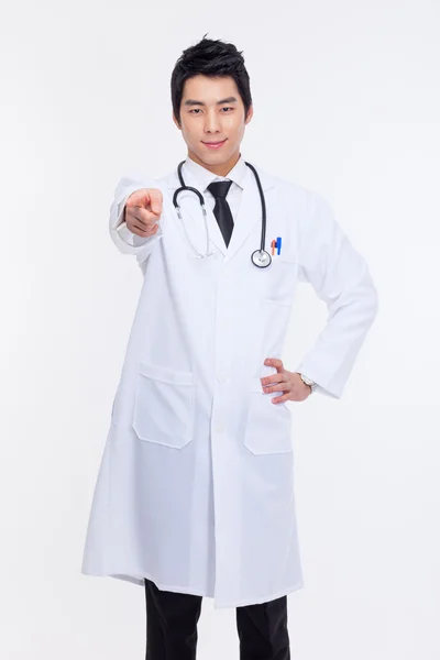 Young asian doctor pointing you — Stock Photo, Image