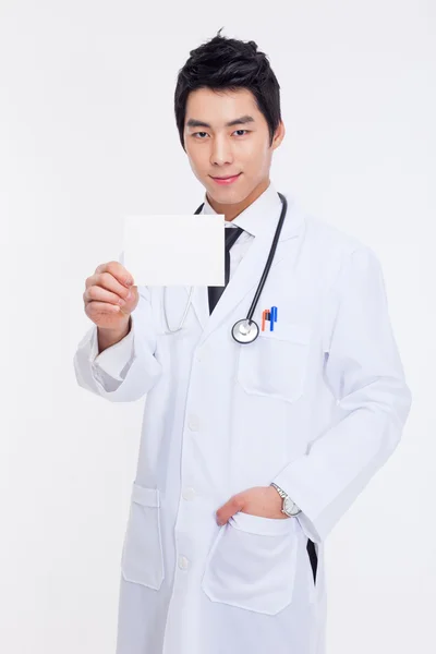 Young Asian doctor showing card — Stock Photo, Image