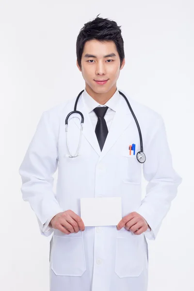 Young Asian doctor showing card — Stock Photo, Image