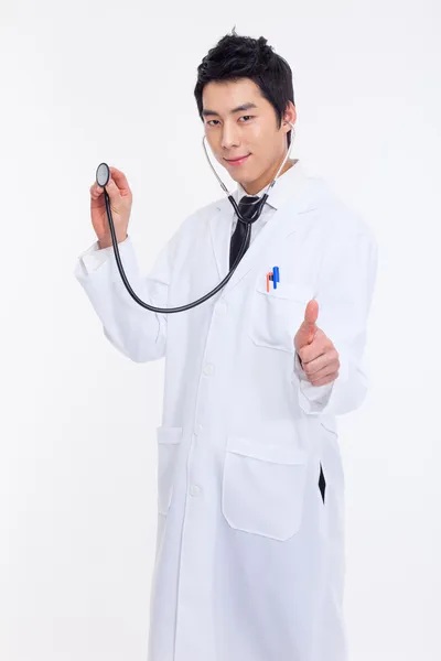 Young Asian doctor using stethoscope — Stock Photo, Image