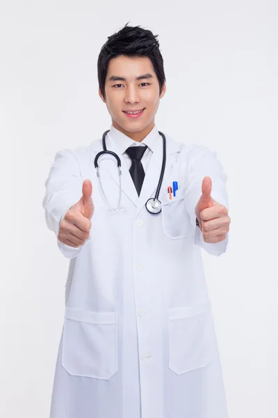 Young Asian doctor showing thumb — Stock Photo, Image