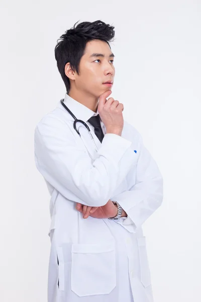 Thinking Young Asian doctor. — Stock Photo, Image