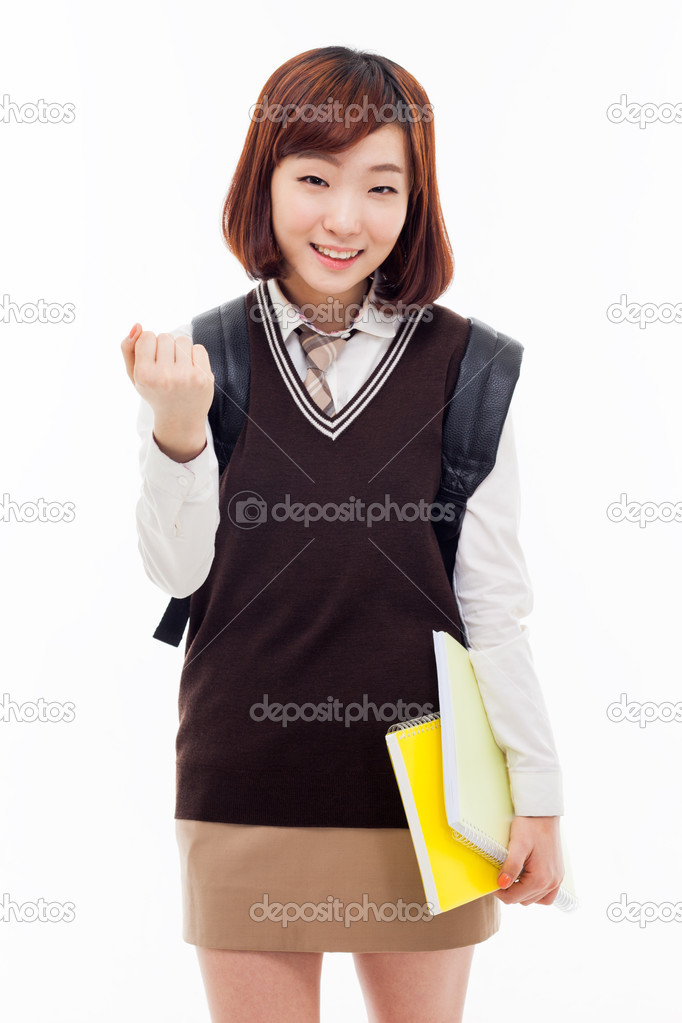 Young pretty Asian student showing fist