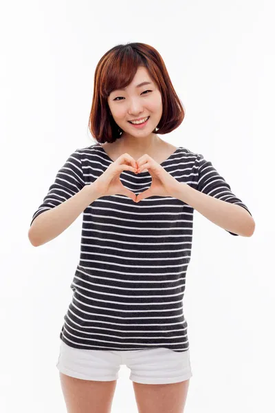 Beautiful Asian casual woman show heart shape. — Stock Photo, Image