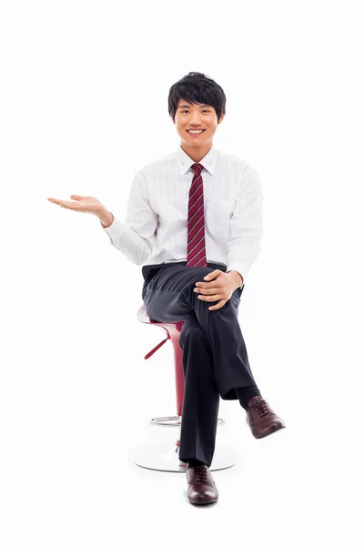 Young Asian business man showing something — Stock Photo, Image