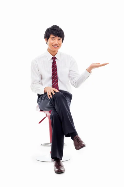 Young Asian business man showing something — Stock Photo, Image