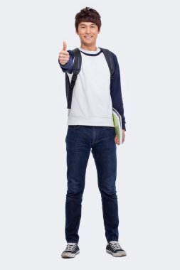 Genç Asyalı öğrenci gösteren başparmak