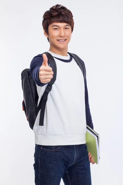 Jovem estudante asiático mostrando polegar — Fotografia de Stock