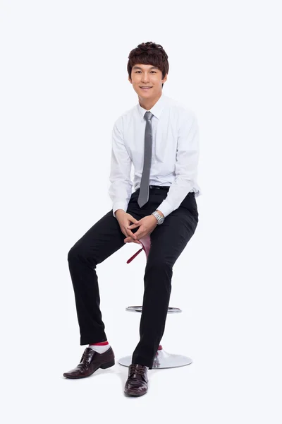 Young Asian business man sitting on the chair. — Stock Photo, Image