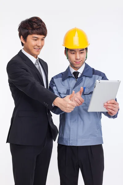 Asian business man and engineer have a pad PC. — Stock Photo, Image