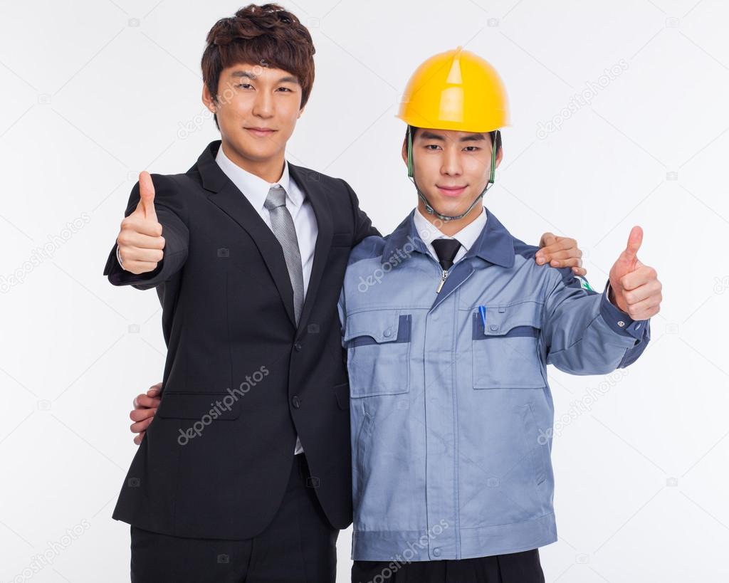 Asian business man and engineer show thumbs.