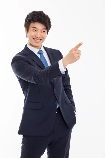 Young Asian business man showing something — Stock Photo, Image
