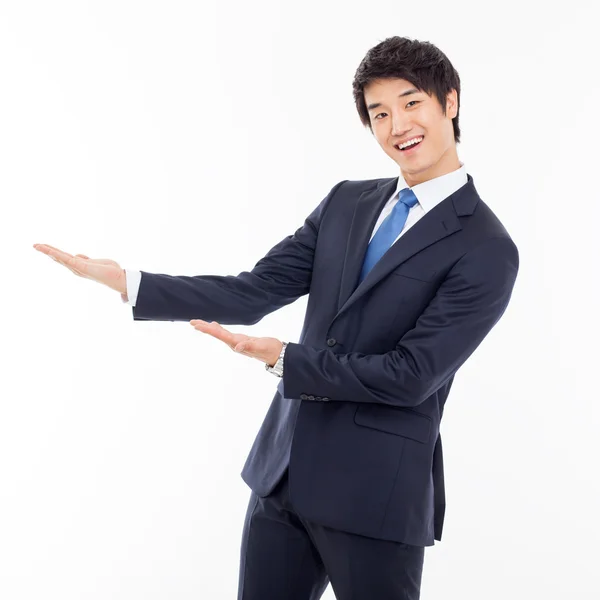 Young Asian business man showing something — Stock Photo, Image