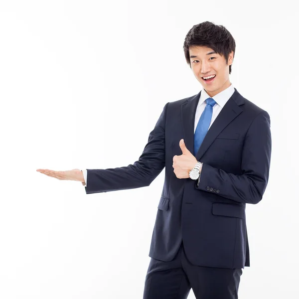 Young Asian business man showing something — Stock Photo, Image