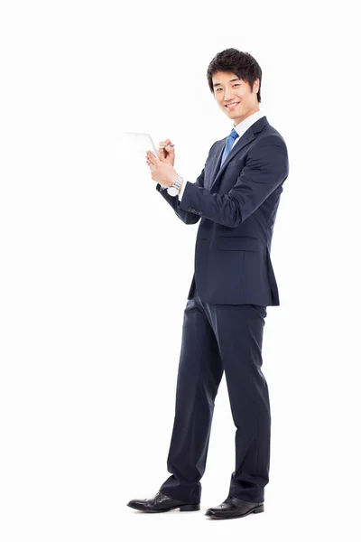 Young Asian business using a pad pc — Stock Photo, Image