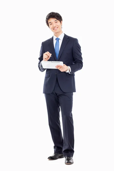 Young Asian business using a pad pc — Stock Photo, Image