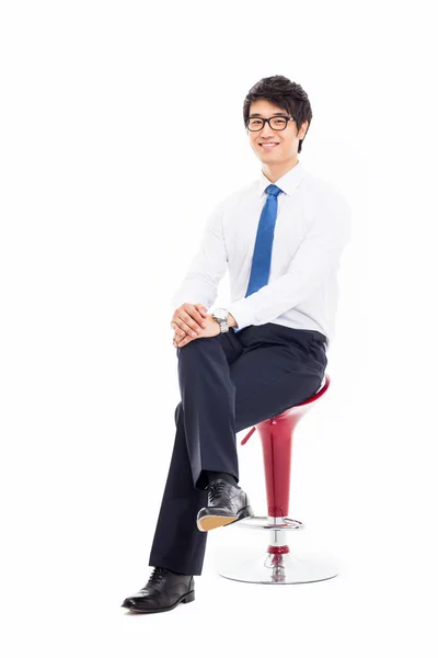 Young Asian business man sitting on the chair. — Stock Photo, Image