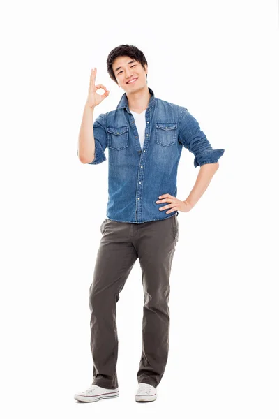 Young asian man showing okay sign. — Stock Photo, Image