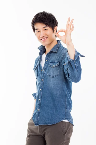 Young asian man showing okay sign. — Stock Photo, Image