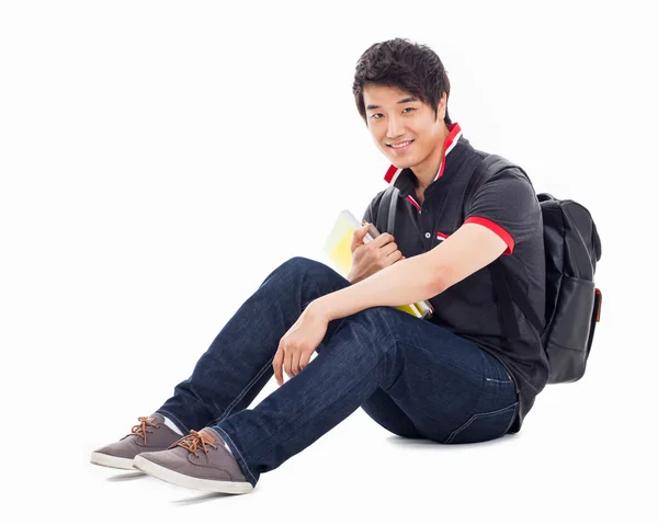 Joven asiática estudiante sentado piso . — Foto de Stock